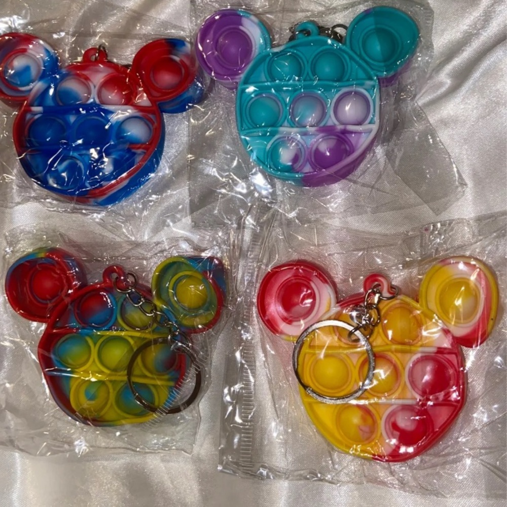 4 Disney pop it keychains